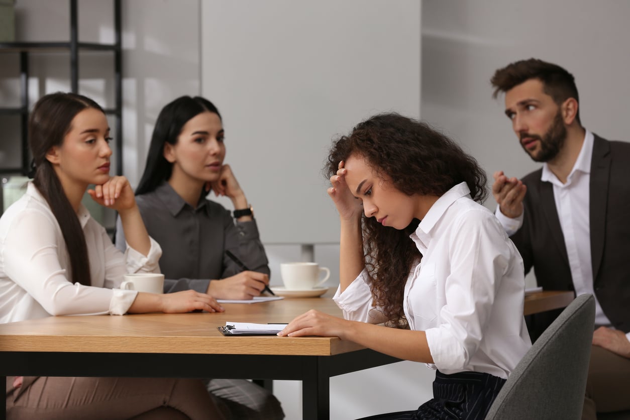 African American woman suffering from racial discrimination at work